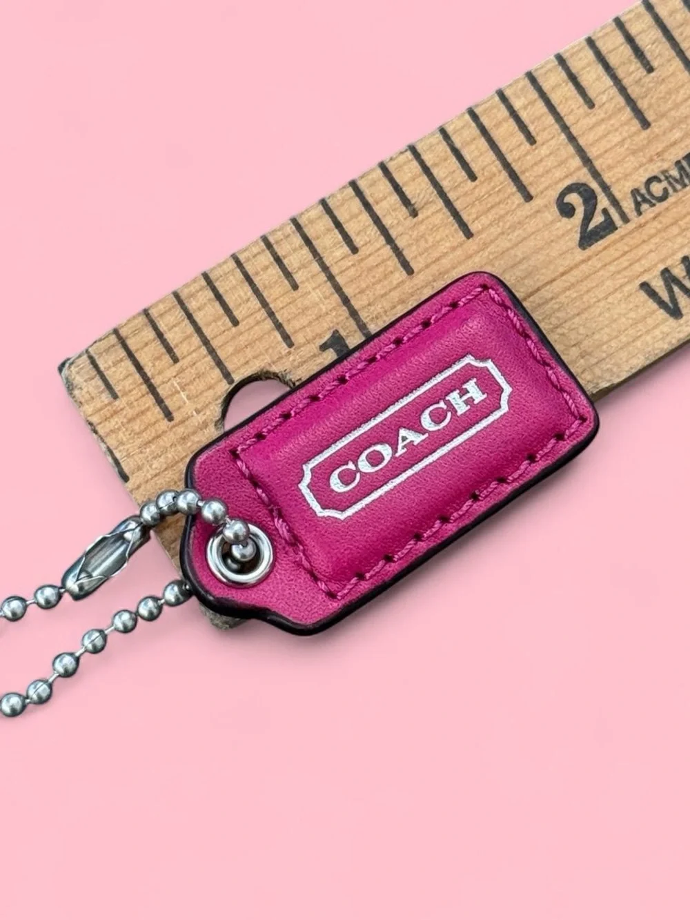 Coach 1.5” pink with silver accent hang tag